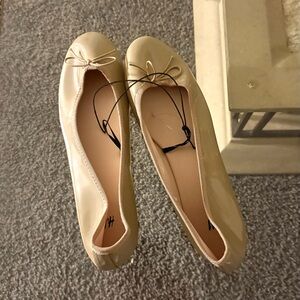 Brand new. H&M Glossy Beige Ballet Flats
